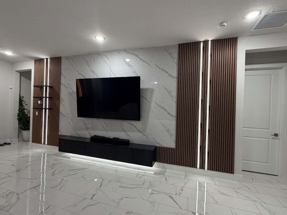 Large marble feature wall with dark wood slat columns